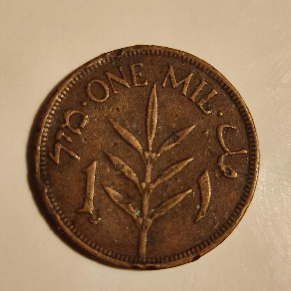 1942 Palestine 1 Mil coin. Estimated VG. to F.
